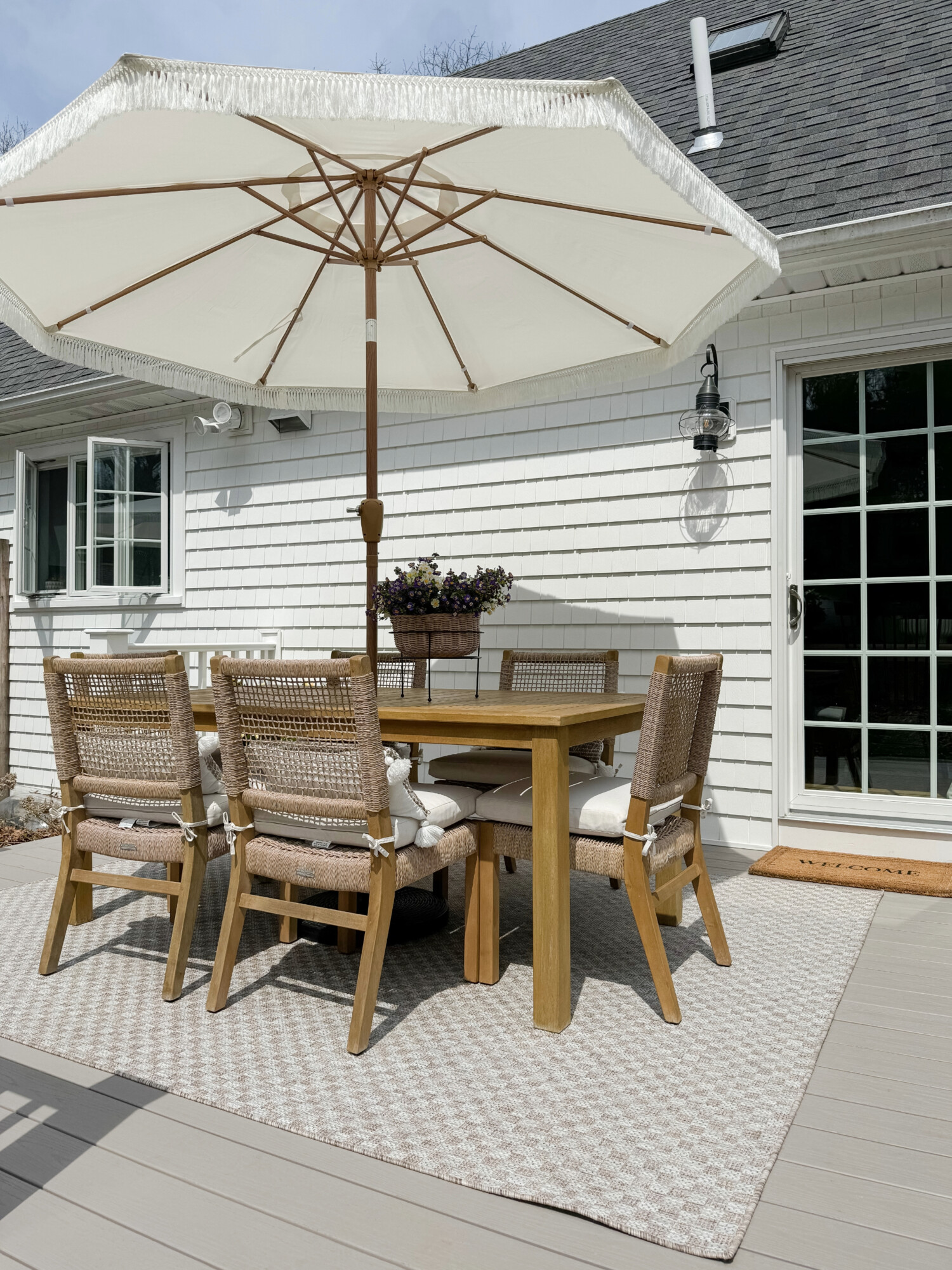 beige outdoor rug from wayfair and outdoor dining