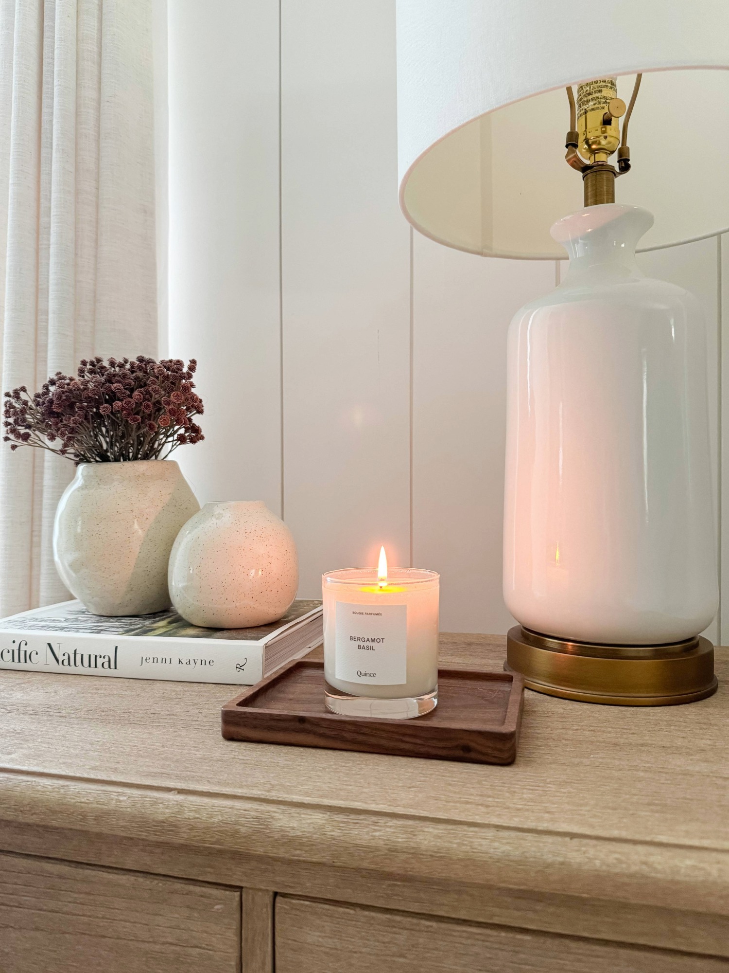 candle burning on side table