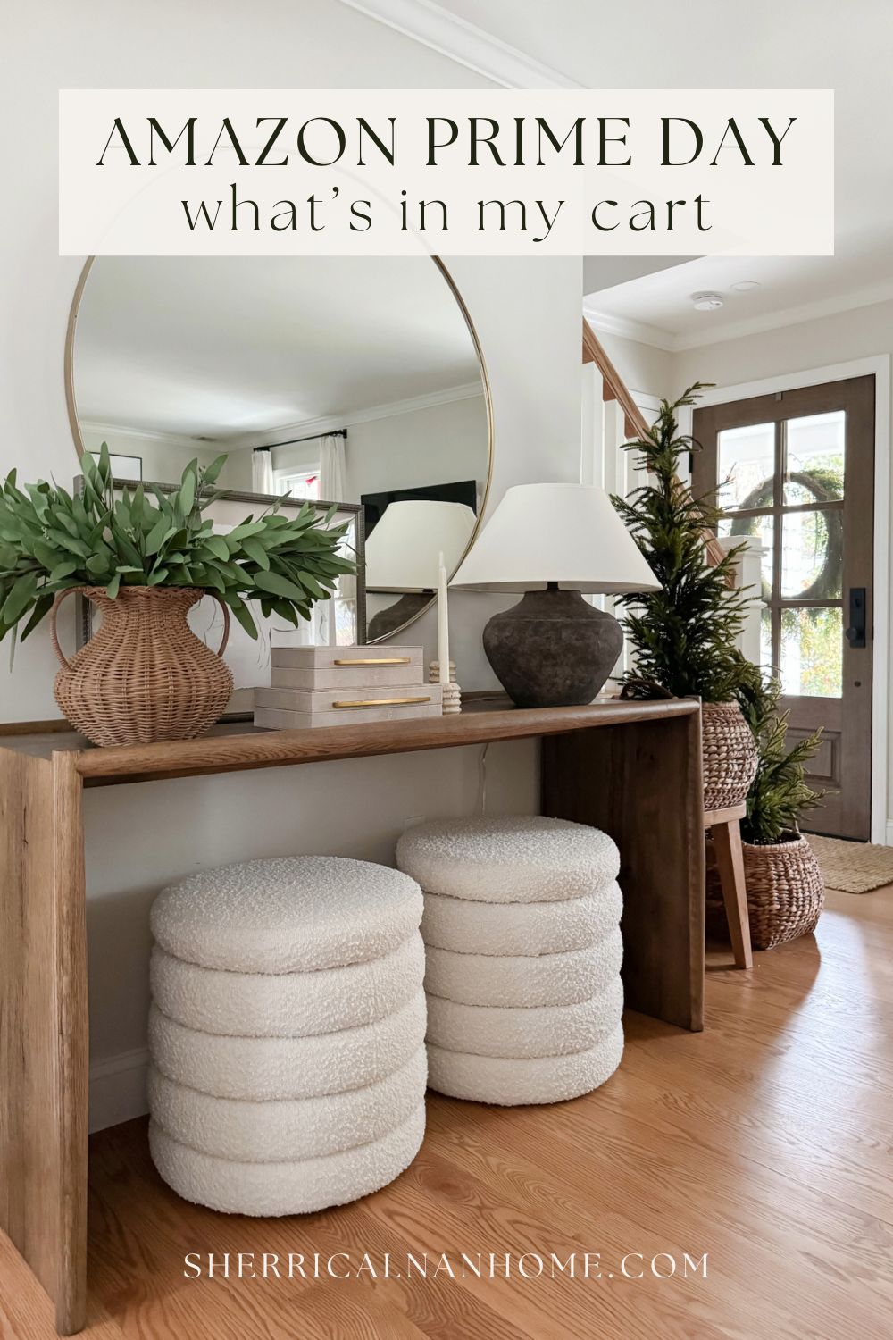Amazon Prime Day home decor picks with a rustic wood console, boucle stools, a large round mirror, a wicker vase with greenery, and a ceramic table lamp for coastal entryway inspiration.