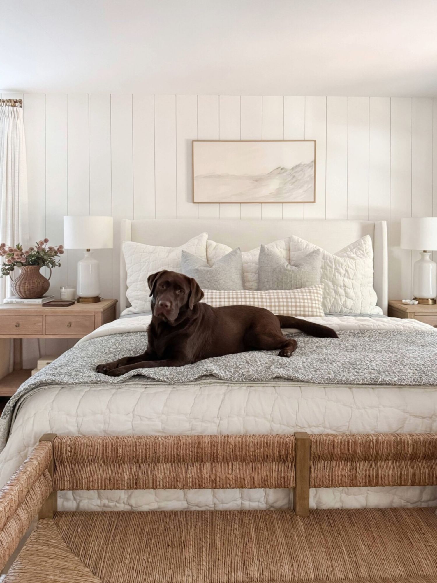 Neutral bedroom with washable bedding, removable throw pillows, and durable rug styled for a pet friendly home.
