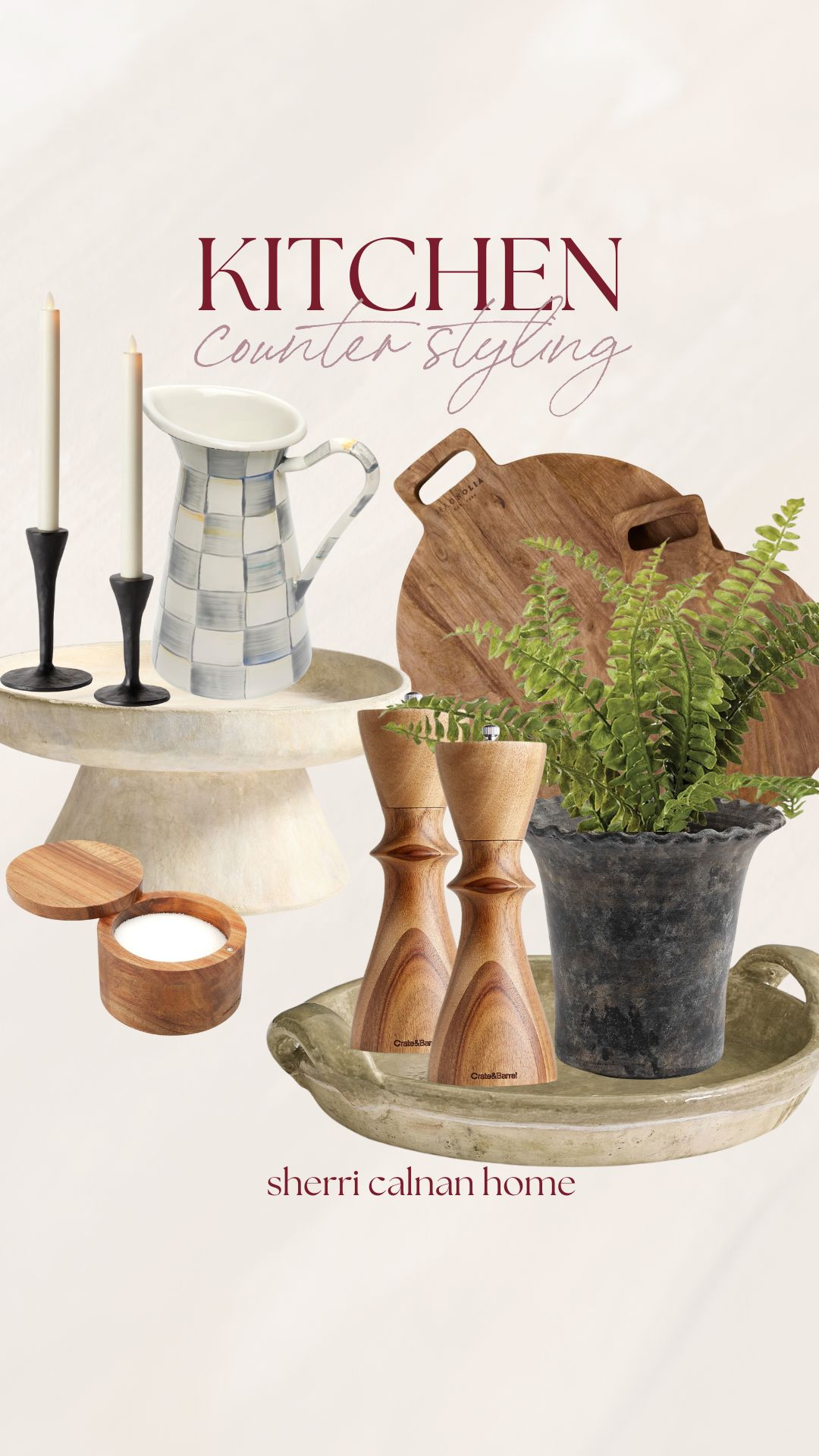 Coastal kitchen counter styling with wood serving boards, ceramic pitcher, greenery, candles, and neutral Cape Cod inspired decor accents.